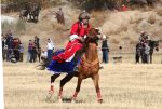 A costumed woman on horseback at the games.