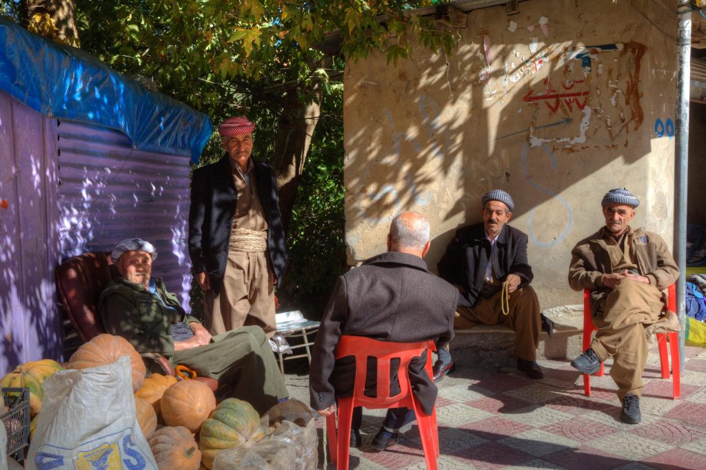 Kurdish men relaxing near a market in Kurdistan. Photo credit: Explore Mesopotamia
