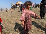 A Marsh Arab child getting to know some visiting travelers. Photo credit: Explore Mesopotamia