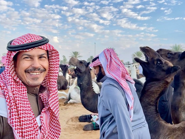 Friendly faces at Buraydah camel market. Photo credit: Michel Behar