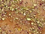 Kunafa: crispy vermicelli and pistachios atop a sweet cheese, drizzled with syrup.