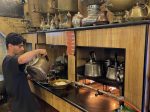 Serving tea in a traditional cafe on Baghdad's Mutannabi Street.