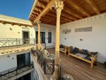 Traditional woodwork sheltering the third floor terrace of the Alexia.