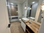 A bathroom at the Alexia, incorporating modern features and traditional style.