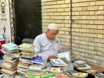 A bookseller on Baghdad's Mutannabi Street. Photo credit: Michel Behar