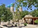 A peekaboo view of blue tile capped minarets at Chor Minor in Bukhara. Photo credit: Michel Behar